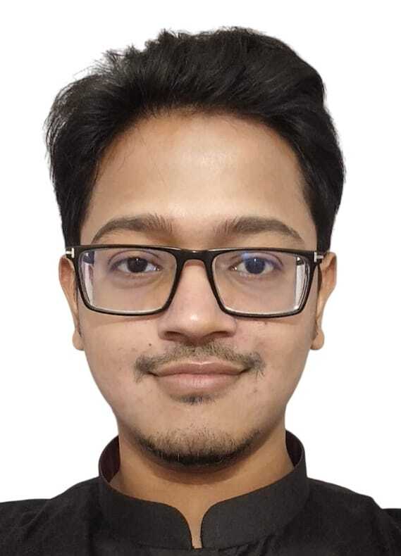 Headshot of Md Abu Bakar Siddique, wearing black glasses and a black shirt, with a slight smile against a white background