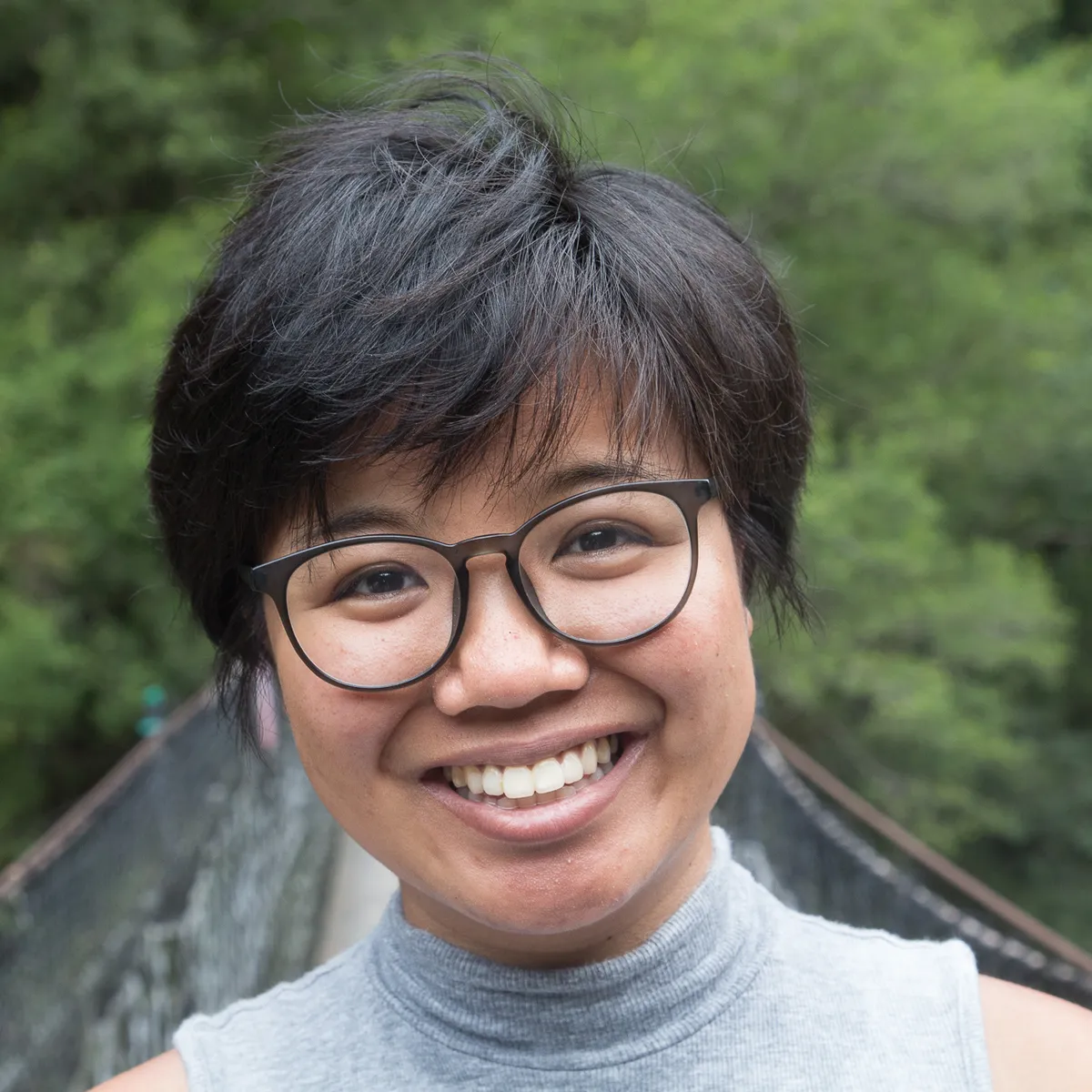 An Asian woman wearing glasses.